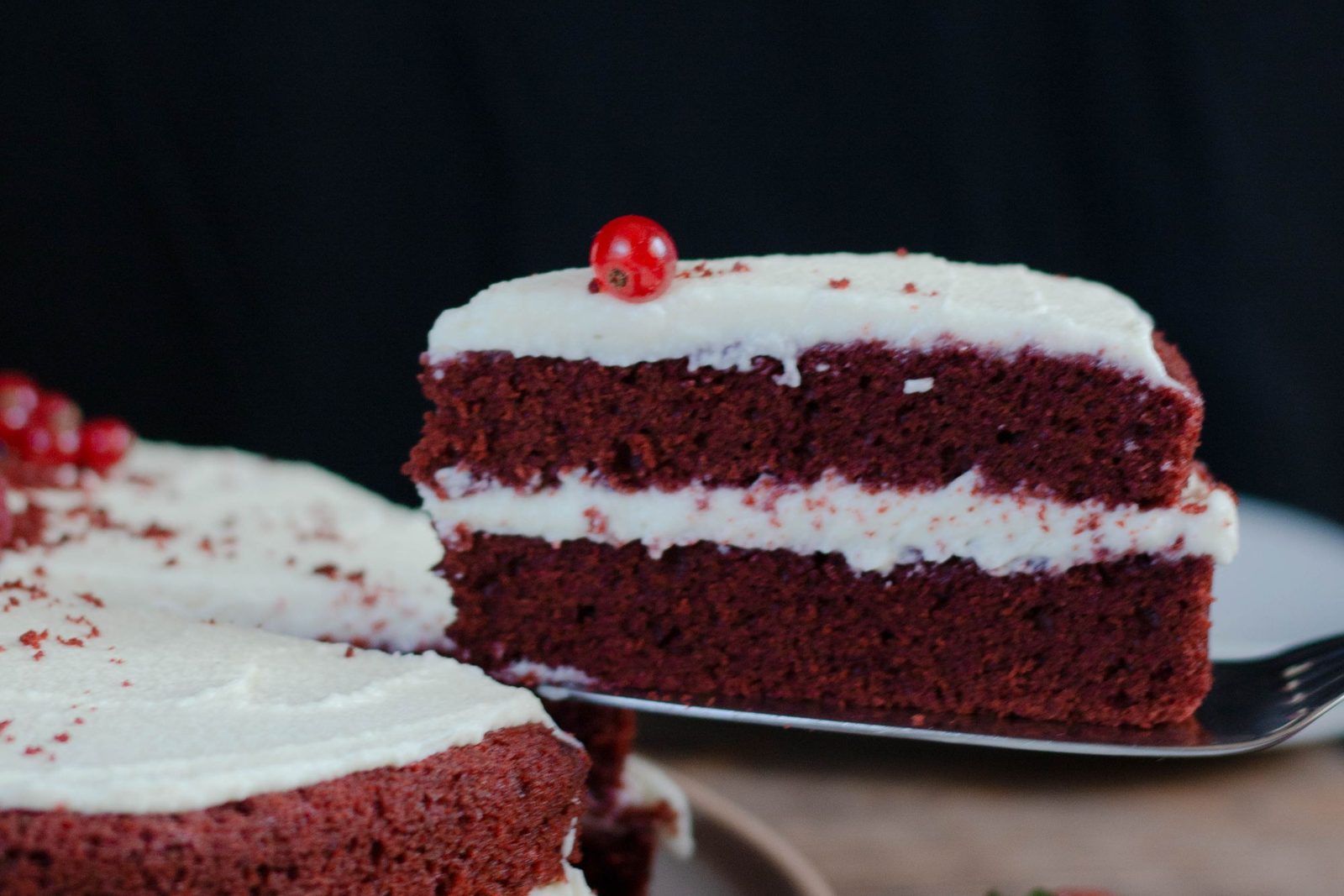 A slice of red velvet cake with cream cheese frosting: one way to choose a cake flavour is to start with the texture you like